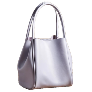 The Anthropologie Hollace Mini Tote is a sleek, pale lavender handbag with a clean, structured design. It features two curved handles for easy carrying, offering a minimalist yet elegant look.