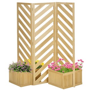 A wooden freestanding trellis with a chevron pattern is paired with three planter boxes containing vibrant flowers, including purple, pink, and yellow blooms.