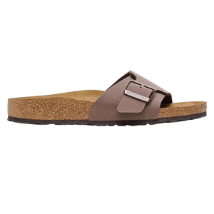 A brown Birkenstock sandal featuring a cork footbed and a single adjustable strap with a metal buckle.