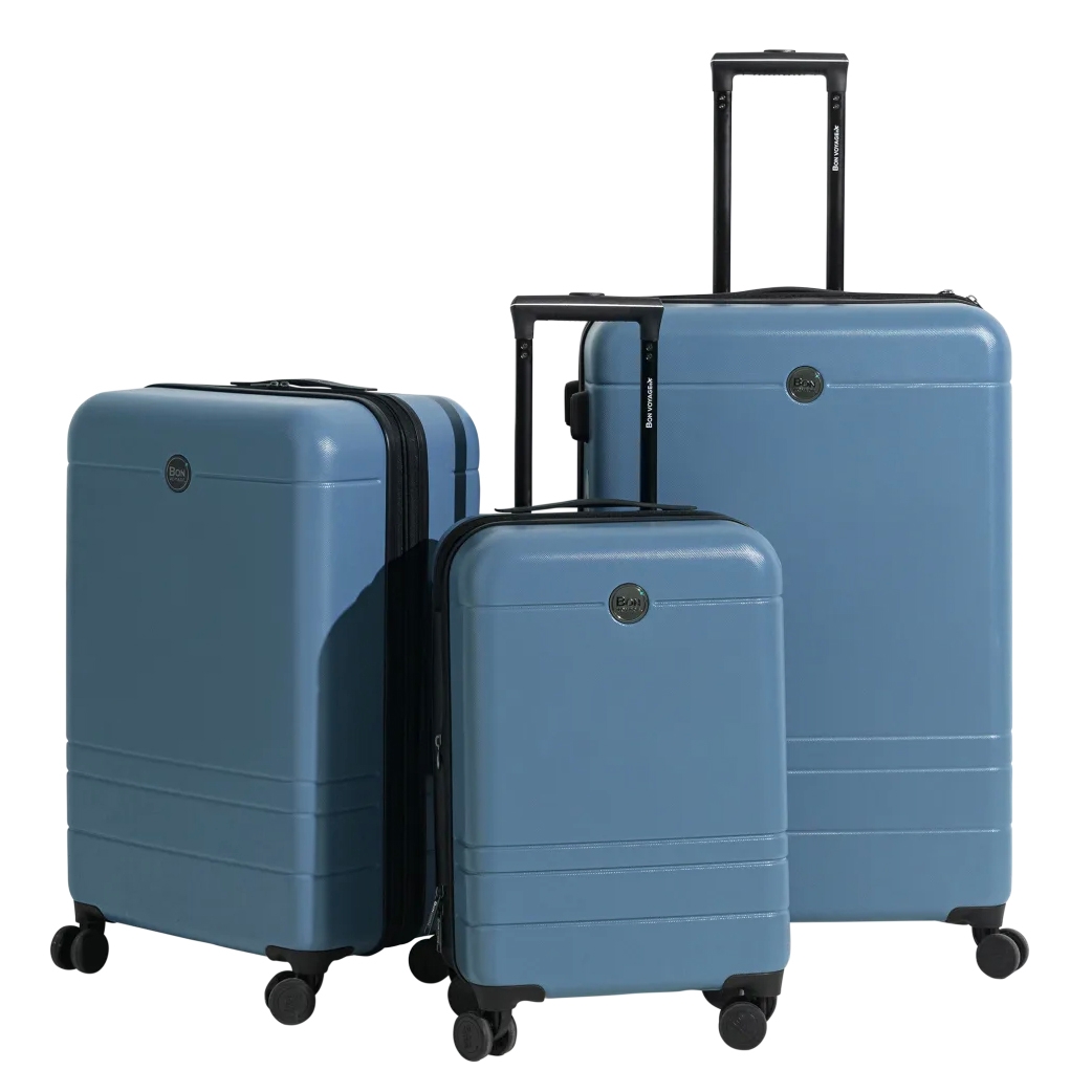 Three-piece luggage set in blue featuring hard-shell design, telescopic handles, spinner wheels, and a sleek minimalist appearance.