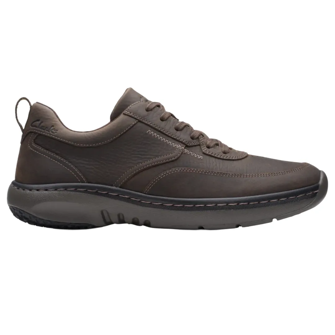 Brown leather lace-up shoe with a sturdy, cushioned sole, featuring subtle stitching and a pull-tab at the heel.