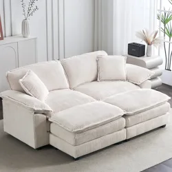 A beige corduroy sectional sofa with cushioned seats and backs, placed in a light-filled living room with decorative plants and accessories.