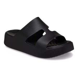 The Crocs Getaway Sandals are black platform sandals with two broad straps featuring cutouts, providing a minimalist design and enhanced comfort for everyday wear.