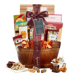 Gift basket with the \“With Sympathy\“ ribbon includes items like Almond Roca, chocolate, caramel, and nuts, presented in a decorative container.