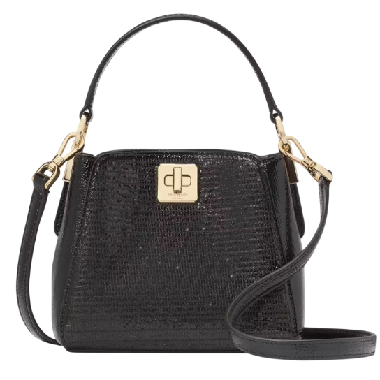 A black Kate Spade Phoebe Glitter Crossbody features a textured glittery surface with gold-tone hardware, a turn-lock closure, a detachable shoulder strap, and a top handle for versatile carrying options.