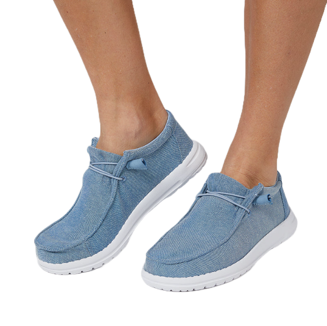 Light blue casual slip-on shoes with white soles, featuring a low-cut design and lace accents.
