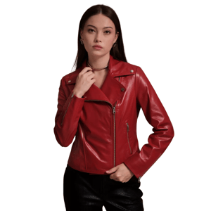 A woman is wearing a red leather motorcycle jacket with asymmetrical zippers and silver hardware, paired with black pants.