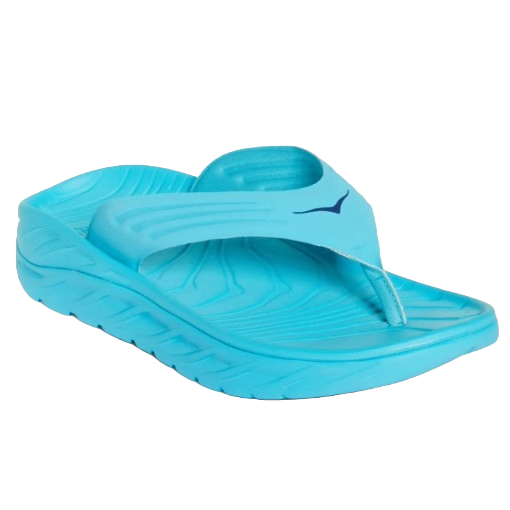 Bright turquoise flip-flop featuring a thick, cushioned sole with textured footbed, wide supportive strap, and a small dark-blue logo near the strap.