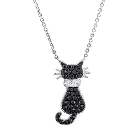 A silver necklace with a pendant shaped like a cat, featuring black stones and a collar with clear stones.