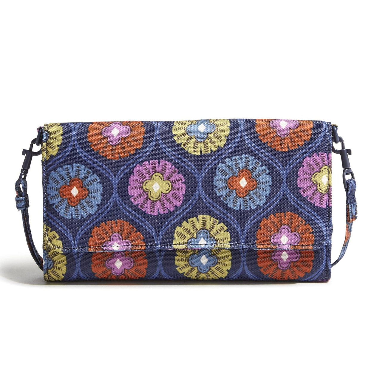A clutch bag with a detachable strap featuring a colorful, symmetrical floral pattern on a dark blue background.