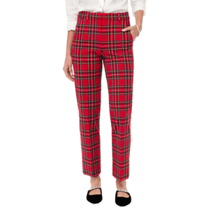 A person wears red plaid pants paired with a white shirt and black flat shoes featuring decorative straps.