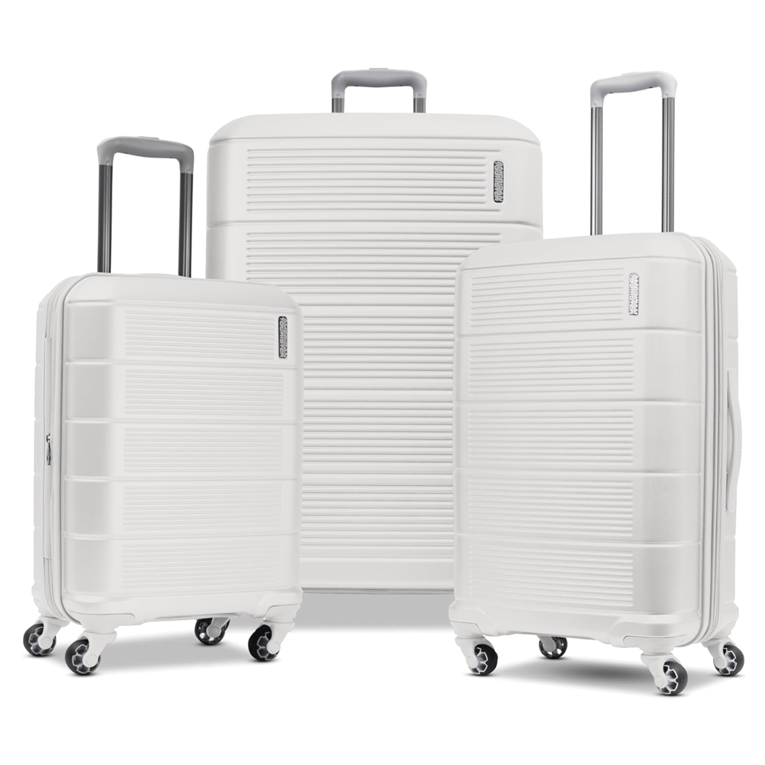 A set of three white hard-shell suitcases with telescopic handles and four multi-directional wheels.