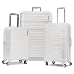 A set of three white hard-shell suitcases with telescopic handles and four multi-directional wheels.