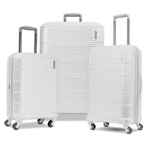 A set of three white hard-shell suitcases with telescopic handles and four multi-directional wheels.