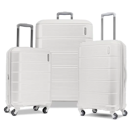 A set of three white hard-shell suitcases with telescopic handles and four multi-directional wheels.