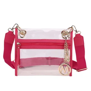 Clear bag with a pink strap and trim, featuring gold hardware and a dangling charm with the letter \“M\“.
