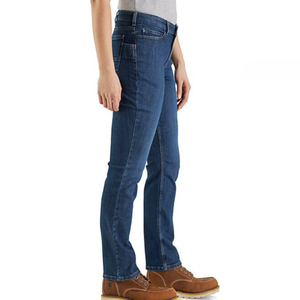 Carhartt Women's Work Jeans in blue feature a straight-leg cut, five-pocket style, and sturdy construction, paired here with brown leather work boots.