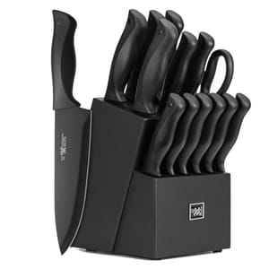 A black knife set with multiple knives of varying sizes and a pair of scissors, all housed in a black block. The knives have black handles and blades, providing a sleek, uniform appearance.