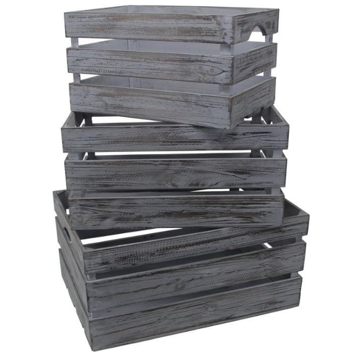 Stack of rustic wooden crates in a weathered gray finish, featuring slatted sides and handles for easy carrying.