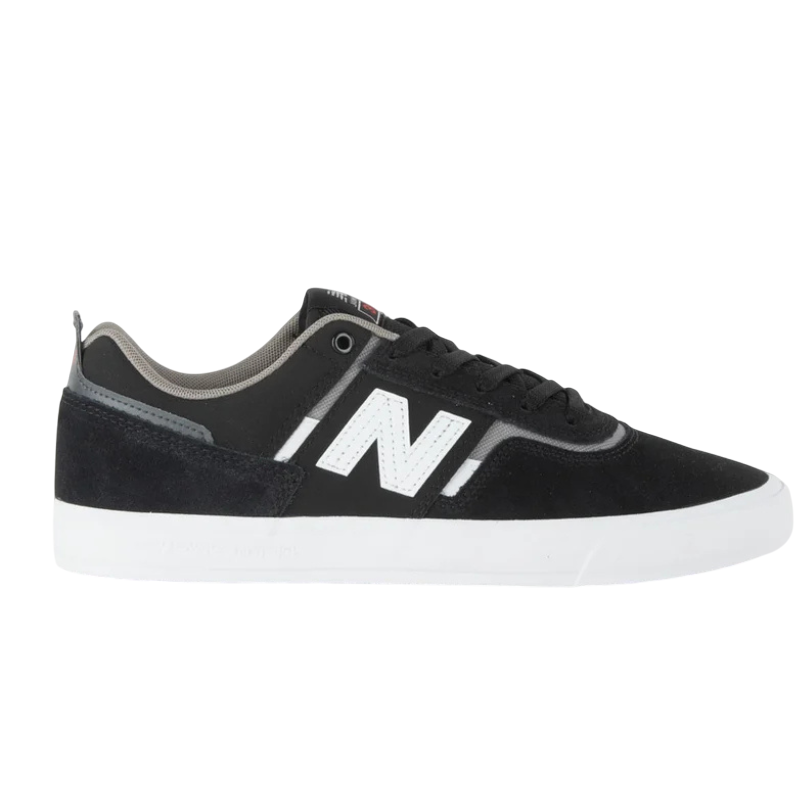 A black New Balance skate shoe with a white \“N\“ logo and a white sole, featuring suede and synthetic materials for durability.