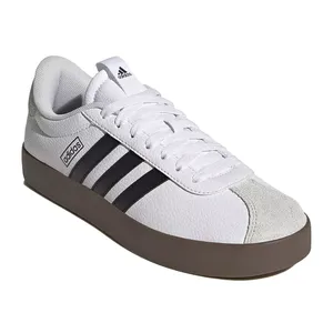 White Adidas sneaker with black stripes, a brown sole, and a suede toe cap.