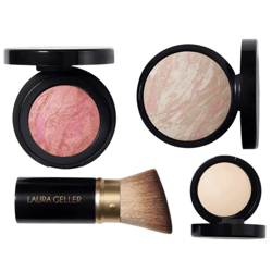 Four makeup items: a pink marbled blush, a beige marbled powder, a light compact powder, and a makeup brush labeled \“Laura Geller.\“