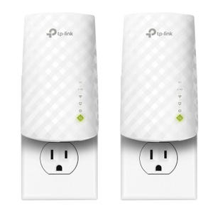 Two TP-Link WiFi range extenders, each plugged into a wall outlet. They feature a compact design with dual-band support (5G and 2.4G indicators), and display LED lights for signal strength and power status.