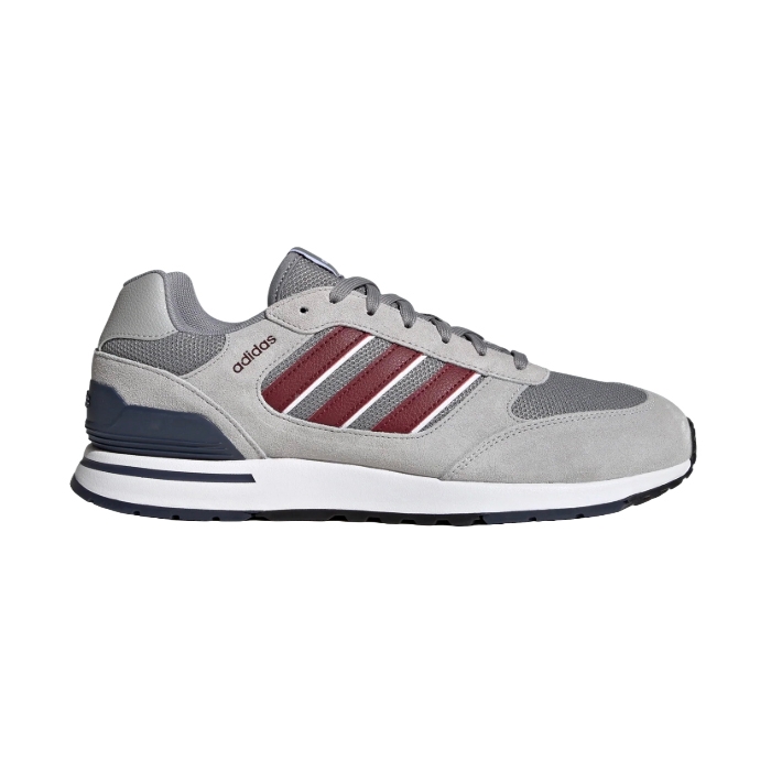Adidas sneaker in gray with burgundy stripes and a white midsole.