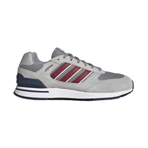 Adidas sneaker in gray with burgundy stripes and a white midsole.