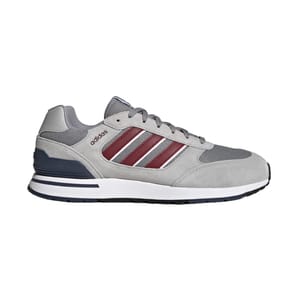 Adidas sneaker in gray with burgundy stripes and a white midsole.