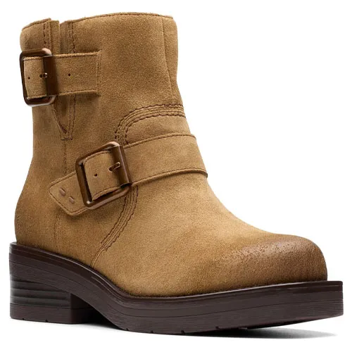 Tan suede ankle boot with two decorative buckles and a dark brown chunky sole.