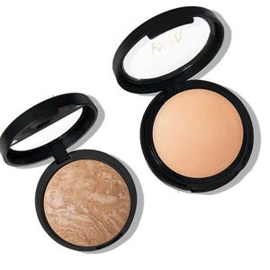 The 2pc Laura Geller Foundation Kit includes a baked marble foundation with a swirled brown and tan design, and a matte beige pressed powder, both housed in round black compacts with mirrors.
