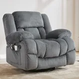 A gray textured recliner chair with padded armrests, a headrest, and a side pocket, placed in a minimal living space with light decor.