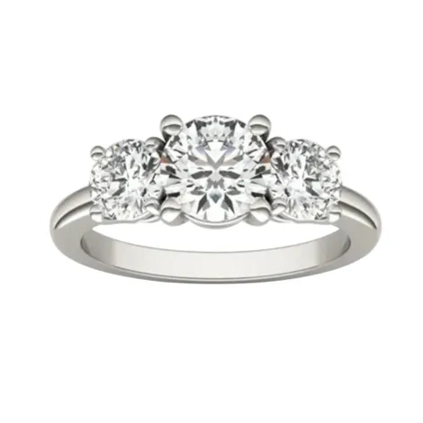 A three-stone diamond ring featuring a larger central round diamond flanked by two smaller round diamonds set in a silver band.