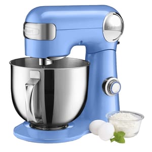 A blue Cuisinart 5.5-Quart Stand Mixer with a stainless steel mixing bowl, accompanied by two eggs and a small bowl of flour.