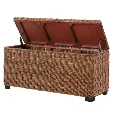 Woven storage box with a hinged lid, featuring a natural rattan appearance on four black legs, providing a stylish storage solution.