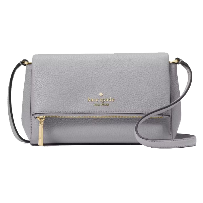 A light gray Kate Spade New York crossbody bag with a pebbled leather texture, featuring a gold logo, a front zipper pocket, and an adjustable strap.