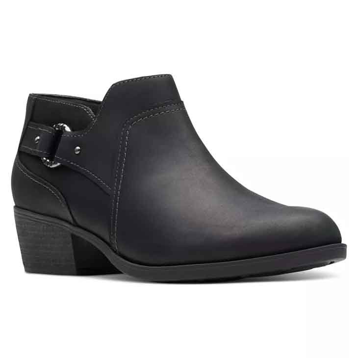 Black ankle booties with a low block heel, featuring a side buckle detail and visible stitching.