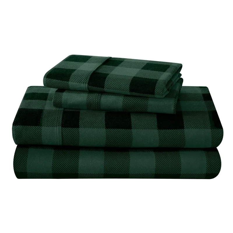 A set of queen-sized cotton flannel sheets in a dark green and black buffalo check pattern, consisting of a flat sheet, fitted sheet, and two pillowcases.