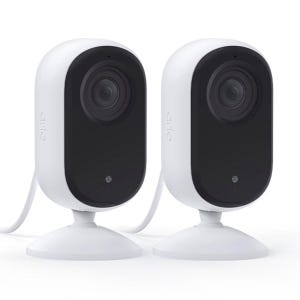 Two Arlo security cameras with a sleek black and white design, featuring a single lens and mounted on a white stand with a connected power cable.