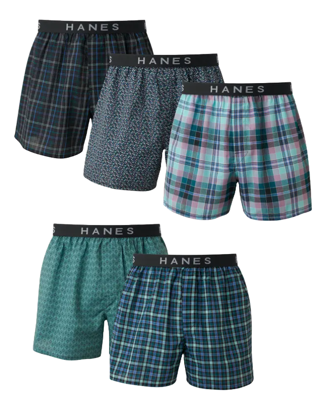 Five pairs of Hanes men's boxers with various patterns including plaid and geometric designs, featuring a black waistband with the brand name.