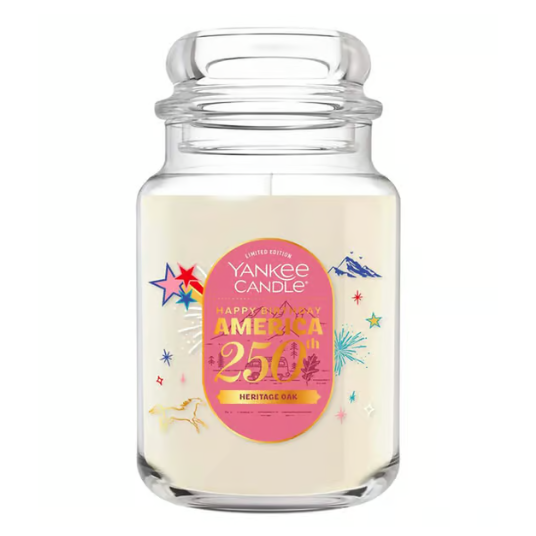 Yankee Candle jar marked as a limited edition for \“Happy Birthday America 250th\“ with a \“Heritage Oak\“ scent, featuring colorful stars and fireworks design.