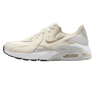 A beige Nike Air Max sneaker featuring a textured upper, visible air cushioning in the midsole, and a black and white outsole.