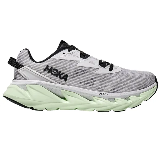 A Hoka running shoe with a black and white upper, and a light green sole. It features ProFly cushioning for comfort and support during athletic activities.
