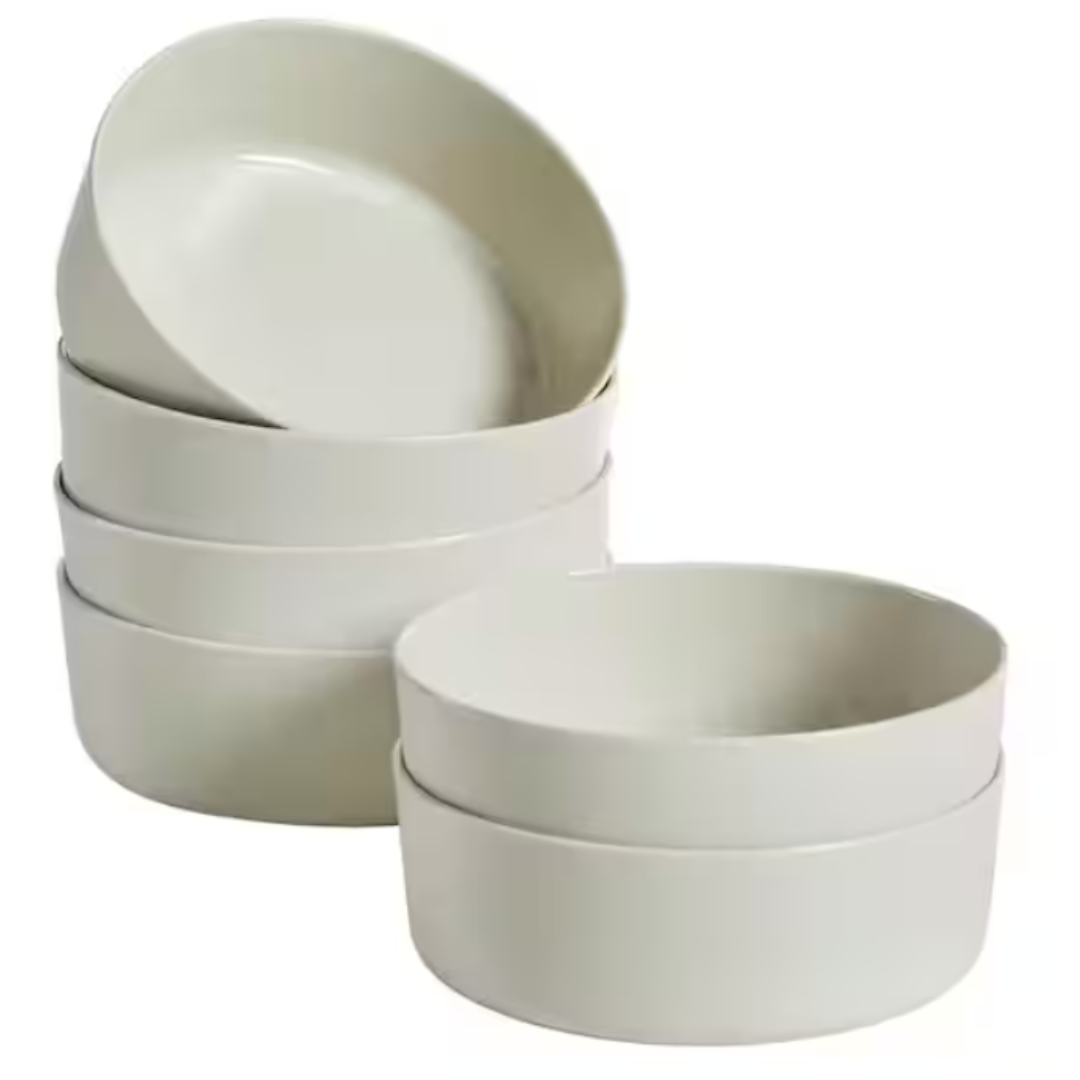 A set of six stackable white ceramic bowls in two sizes.