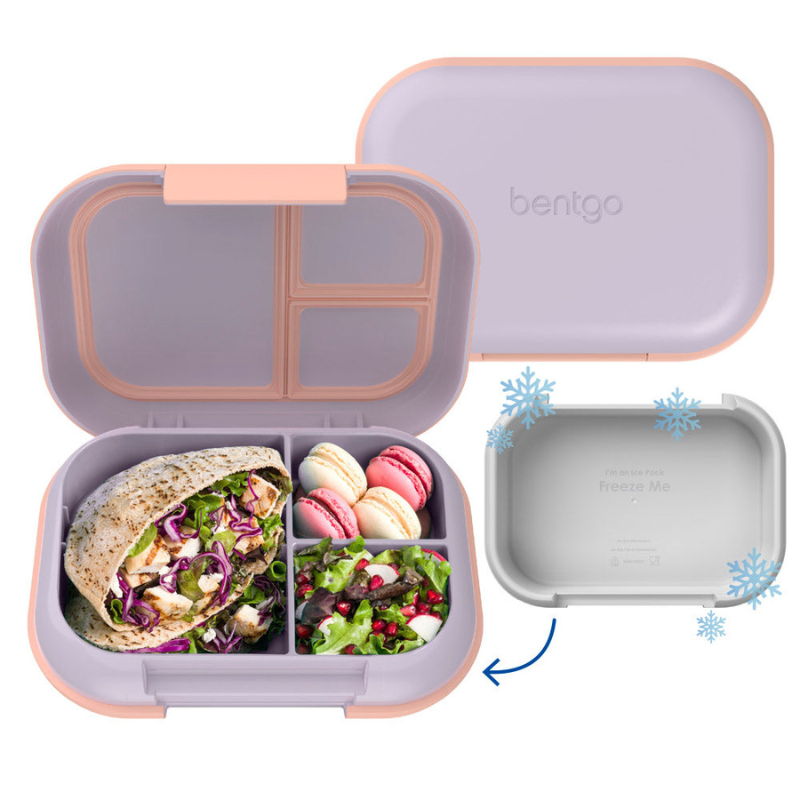 Bentgo Chill Max Lunch Box features a lavender and peach color scheme with three compartments, including an ice pack integrated into the lid for keeping food fresh, with contents like a pita wrap, macarons, and salad.