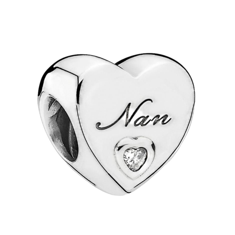 Silver heart-shaped charm with \“Nan\“ engraved, featuring a small heart-shaped crystal.