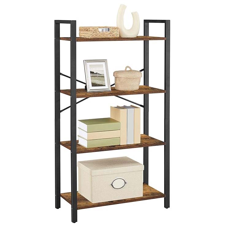 A five-tier open bookshelf with a black metal frame and wooden shelves holds decorative items like a framed picture, ceramic vase, woven basket, books, and a storage box.