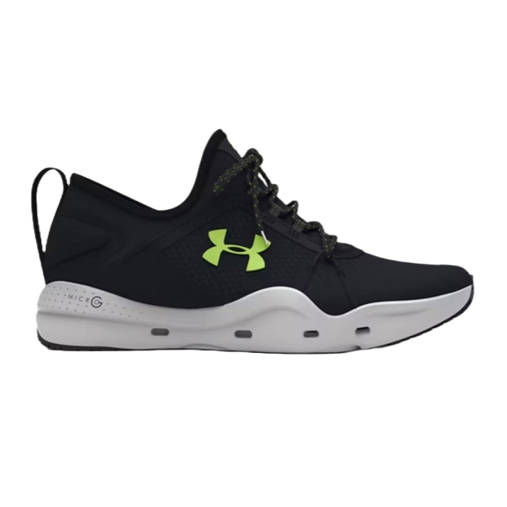 Under Armour Micro G Fishing Shoes in black with a white sole, featuring a lime green logo and Micro G cushioning. The design includes a loop on the heel and breathable mesh material for comfort and flexibility.