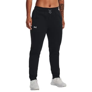 Black joggers with a drawstring waistband and a white Under Armour logo on the left thigh, paired with white sneakers.